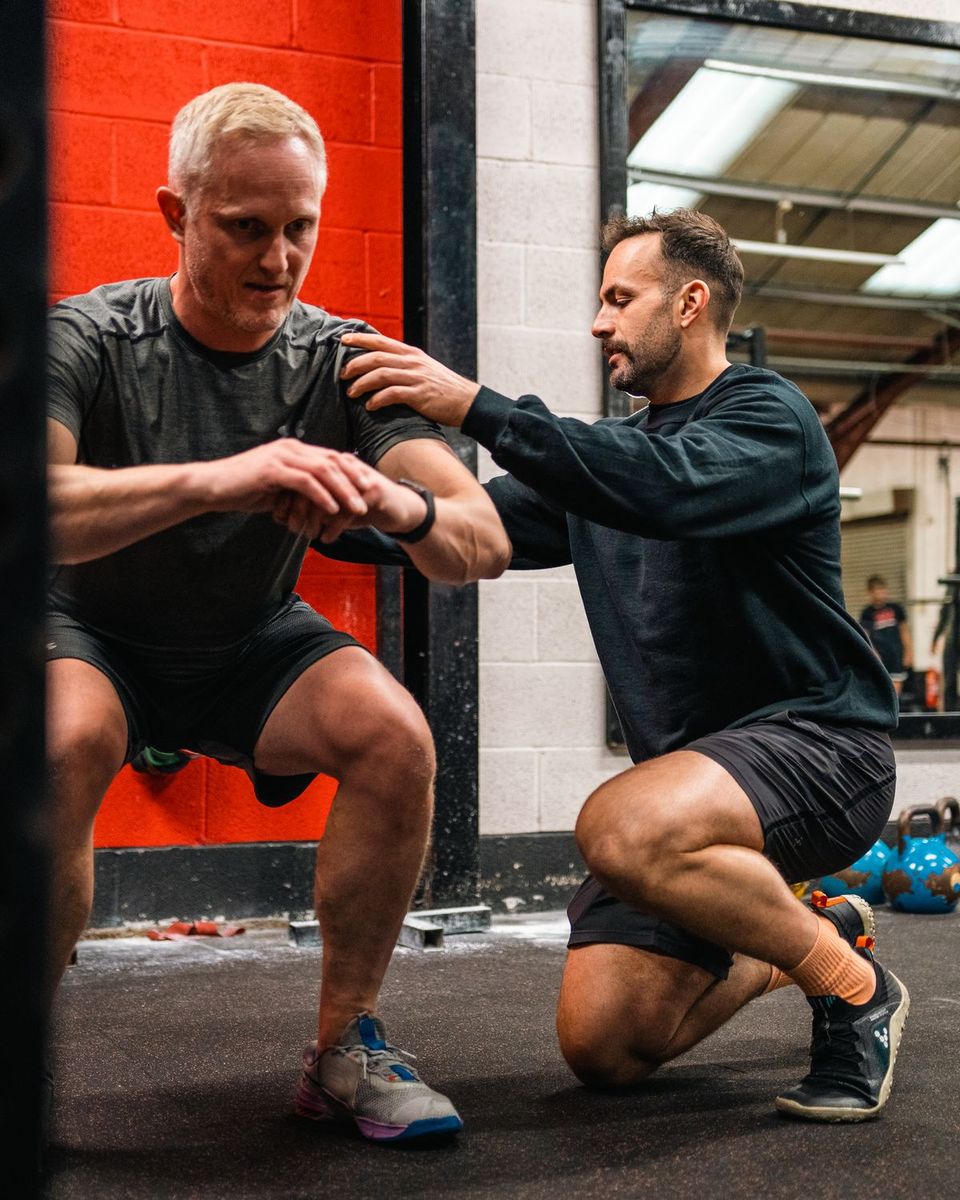 S&P coach cueing a squat